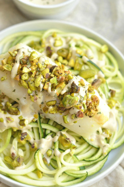 Pistachio Baked Cod with Tahini Zucchini Noodles